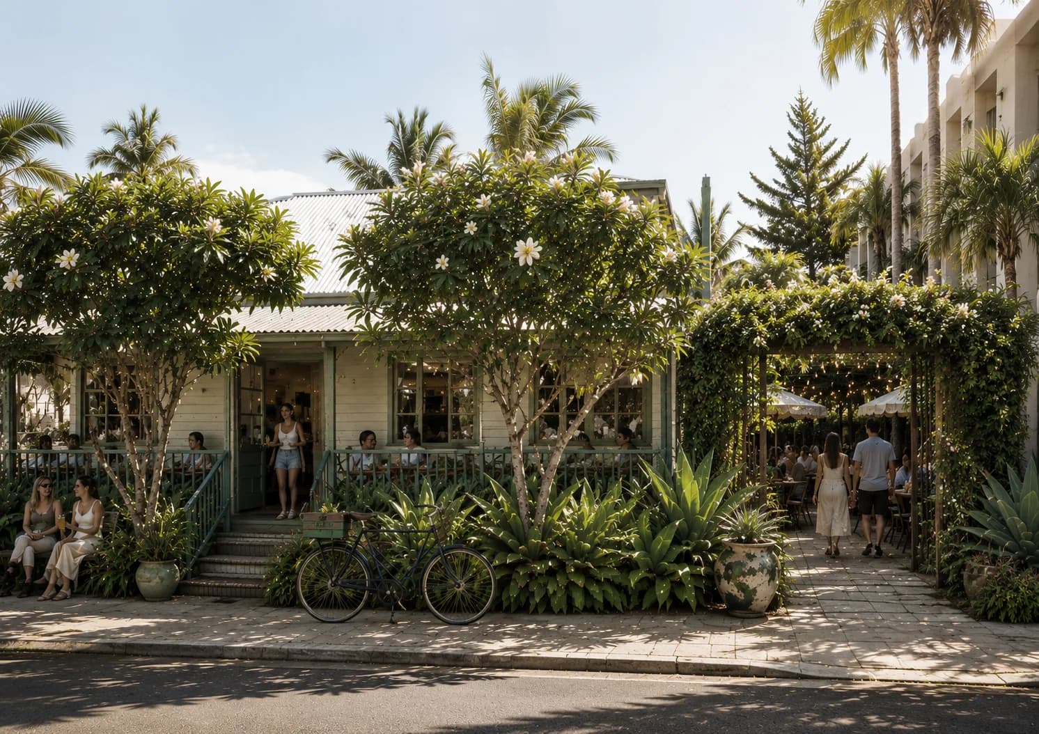 Courtyard hospitality setting at the proposed Byron Bay venue, with covered outdoor dining among established trees
